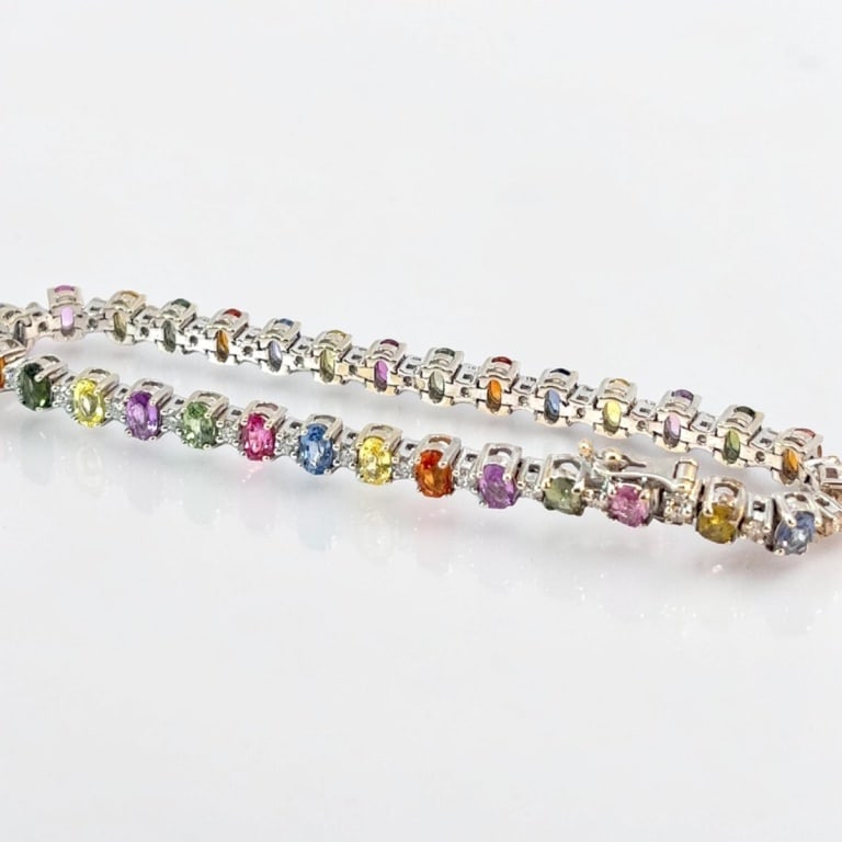 Vintage 18K, Sapphire & Diamond Bracelet: Vintage 18 Karat White Gold Multi Colored Sapphire and Diamond Bracelet. Diamond: .68 TCW. Measures 7-1/4" L. Approx. weight: 17.3 grams. Condition: Good condition. Estimate 1500 - 2500 Domestic
