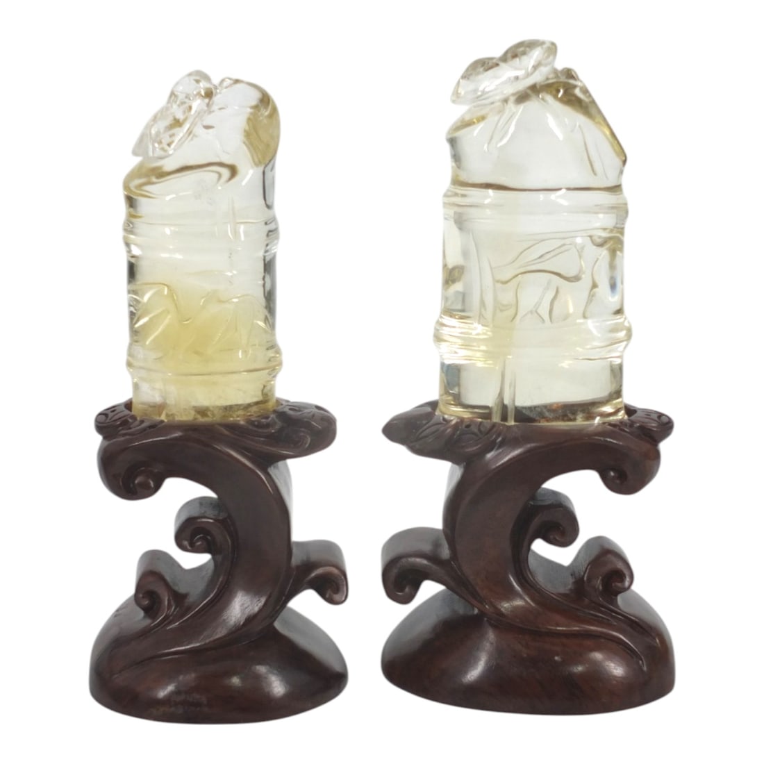 Pair Chinese Citrine Quartz Sculptures "Bamboo": Pair Chinese Carved Citrine Quartz Sculptures "Bamboo" on carved wood stands. Depicting bamboo joints with insects. Unsigned. Measures 7-1/2" H each. Condition: Good condition. Estimate 100 - 200