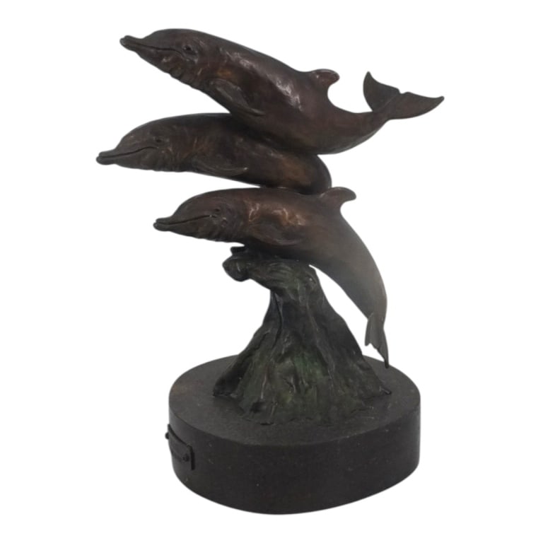 1985 Carl Wagner Bronze Dolphin Sculpture "Splash": Carl Wagner (American 20th C) Bronze Dolphin Sculpture "Splash". Signed, dated 1985 and numbered 37/50. Measures 14" H x 9". Condition: Good overall condition consistent with age, display and