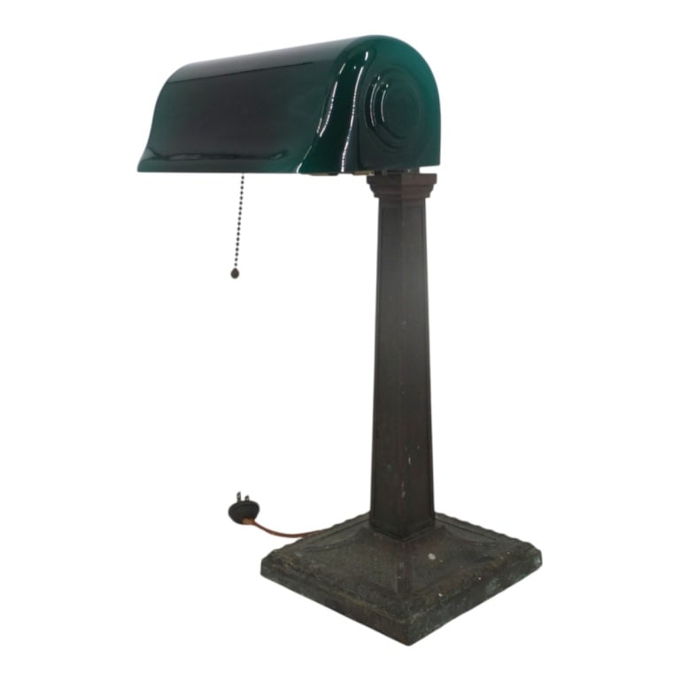 Antique Verdelite Emerald Bankers Lamp: Antique Verdelite Emerald Bankers Lamp. Circa 1917. Bronze base. Base measures 16" x 7" x 7", shade 3-1/4" x 8-3/4" x 5". Condition: Good antique condition consistent with age and use. Estimate 200 -