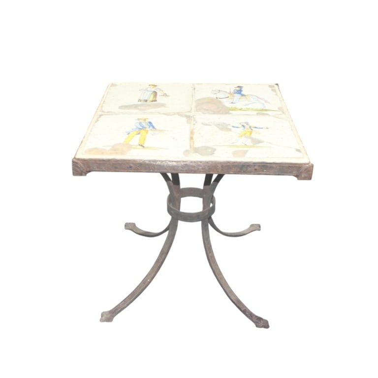 Antique Valencia Tile & Iron Table, Circa 1900: Antique Iron and Tile side or occasional table, rendered in hand hammered and forged iron with a set of four inset Valencia tiles depicting whimsical pastoral scene. Spain, Circa 1900. Unsigned.