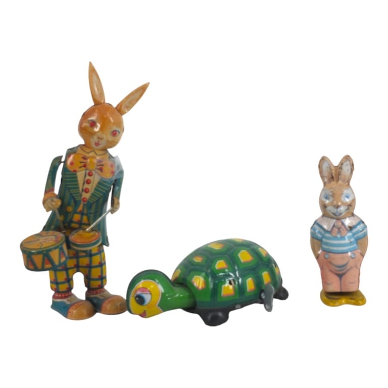 Grouping of Circa 1930s Tin Wind Up Toys: Grouping of Three Circa 1930s Tin Wind Up Toys. Markers: J. Chien Co., Daiya. Tallest measures 9" x 4". Smallest measures 2-1/2" x 3-3/4" x 6". Please note that the working condition of the mechanical