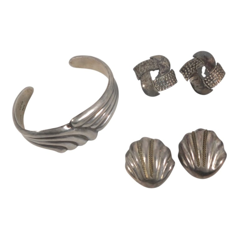 Vintage Mexican Sterling Silver Jewelry Lot: Vintage Mexican Sterling Silver Jewelry Lot. Includes: cuff bracelet and 2 pair earrings. Signed Mexica 925. Cuff measures 2-1/2" X 1-1/4". Lot measures approx. 69 grams. Condition: 1 post missing, in