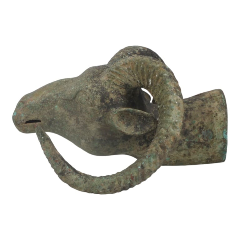 Antique Chinese Bronze Rams Head Finial: Antique Chinese Bronze Rams Head Finial. Possibly a chariot pole ornament. Hollow with 3 holes at neck base. Unsigned. Measures 13" L x 10-1/2" W x 6" D. Bottom hole with a 4-1/2" opening. Condition:
