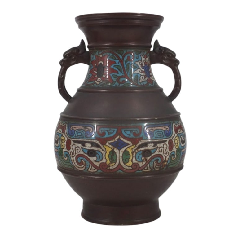 Antique Japanese Champleve Bronze Urn: Antique Japanese Champleve Bronze Urn with Figural Handles. Signed MADE IN JAPAN on bottom. Measures 11-1/2" x 8". Condition: The foot is slightly out of round or in good condition consistent with
