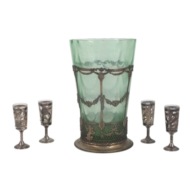 Depression Glass Vase, 4 Silver Overlay Cordials: Depression Glass Vase with Silver Plate Frame. Signed MWC Co. 811. 8113. Measures 8-3/4" x 5-1/2". 4 Sterling overlay cordial glasses. Signed Sterling ELA 925. Measures 3-1/8". Condition: Depression g