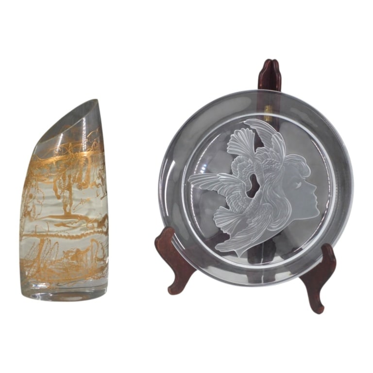 Grouping of Art Glass Tableware: Grouping of Two Vintage Art Glass Tableware. Includes a Luciana Roselli plate together with a painted glass vase. Plate measures 12-3/4" x 1-3/4". Vase measures 12-3/4" x 5-1/2". Condition: Good