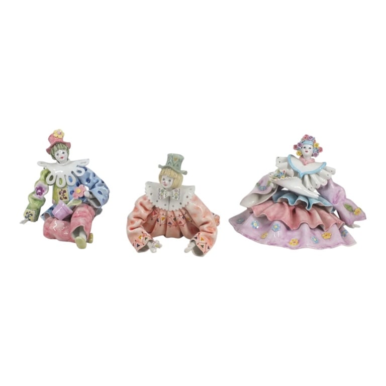 Grouping of Italian Porcelain Figurines: Grouping of Three Italian Faience Porcelain Clown Figurines. Each marked made in Italy. Largest measures 7-3/8" x 10-1/4". Smallest measures 7-1/4" x 7". Condition: One has a chip to the collar.
