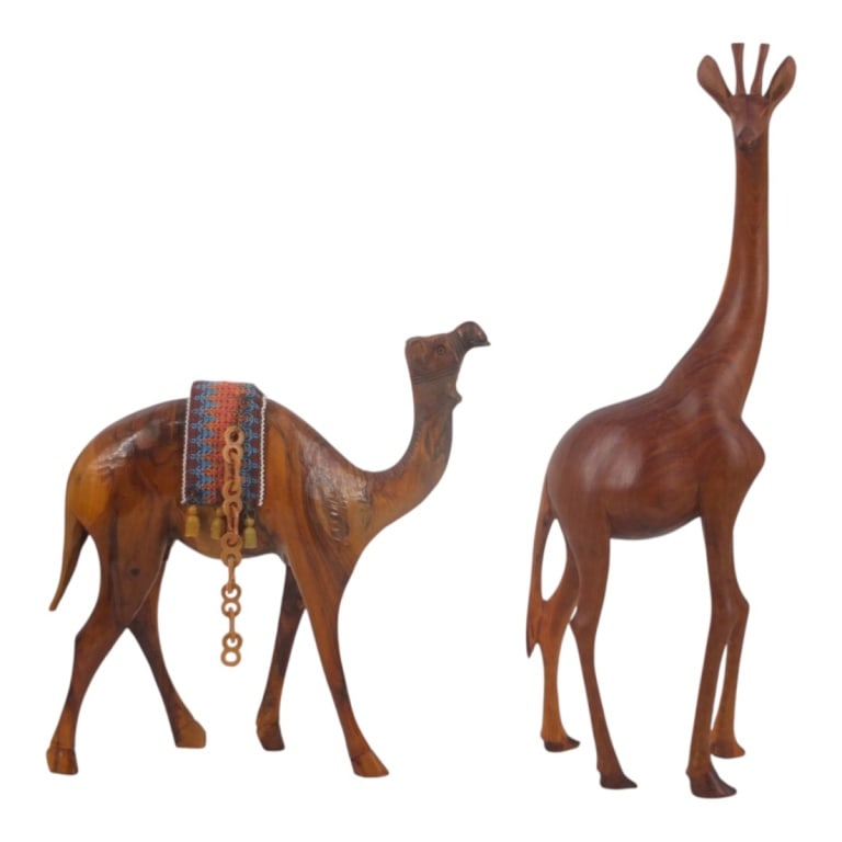2 Hand Carved Wood Animals Giraffe & Camel: 2 Hand Carved Wood Animals. Includes Giraffe, unsigned, 17-1/2" H x 5-1/2"; Camel, unsigned, 11" x 11". Condition: Good condition. Estimate 50 - 500 Domestic shipping Third Party