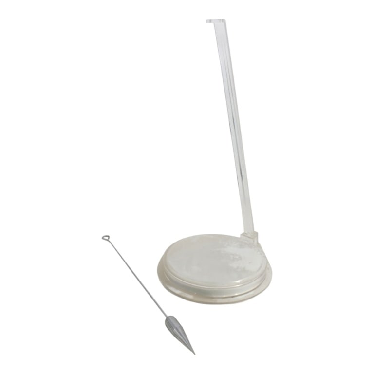Vintage Lucite White Sand Pendulum: Vintage Lucite White Sand Pendulum. Unsigned. Measures 22" H x 12" W. Condition: Missing hook for pendulum. Wear consistent with age and use. Estimate 20 - 40