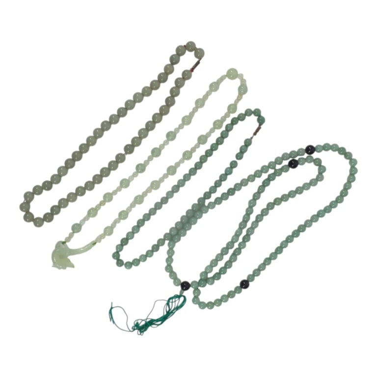 4 Vintage Chinese Jade Beaded Necklaces: 4 Vintage Chinese Jade Beaded Necklaces. Includes: Pale green beads with a dragon toggle/pendant, 24" L. Pale green bead with screw closure, 20" L. Light green beads with screw closure, 18"L. Light