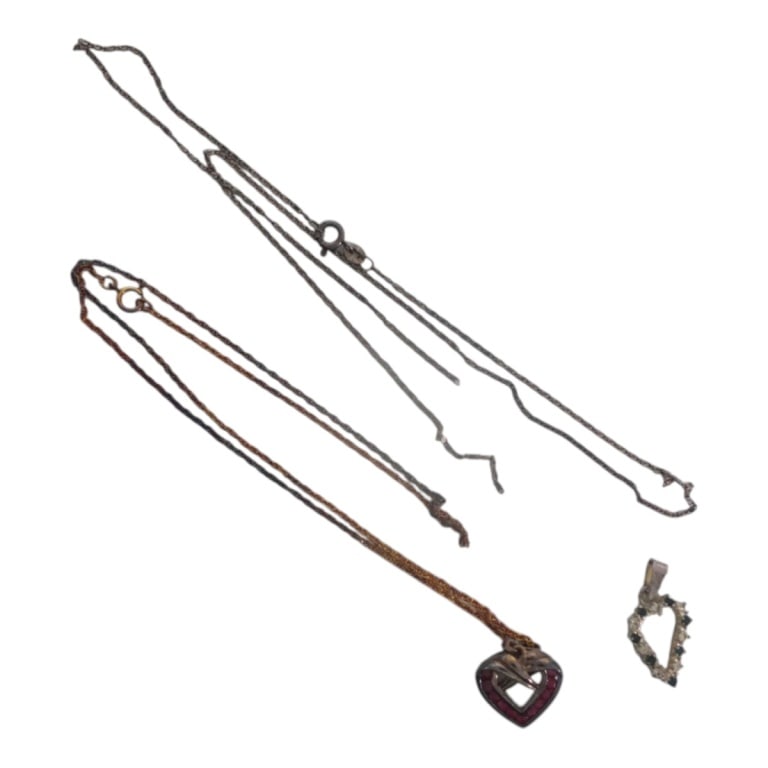 2 Miniature Silver & Gemstone Heart Pendants: 2 Miniature Silver & Gemstone Heart Pendants. Both on silver chains. One pendant set with rubies, the other with diamonds and sapphires. Signed Sterling or 925. Total weight approx. 9 grams.