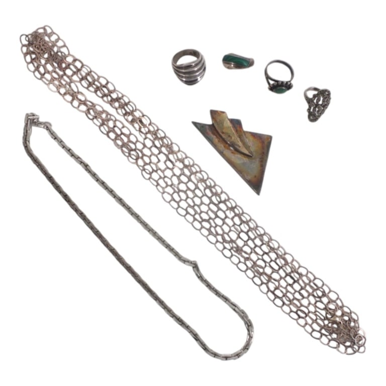 Vintage Sterling Silver 7 Piece Jewelry Lot: Vintage Sterling Silver 7 Piece Jewelry Lot. Includes a rolo link necklace 18; cable link chain necklace, 100"; Nancy Rise modernist pendant 2-1/2" x 1-1/4"; lapis ring size 6, turquoise ring size 6;