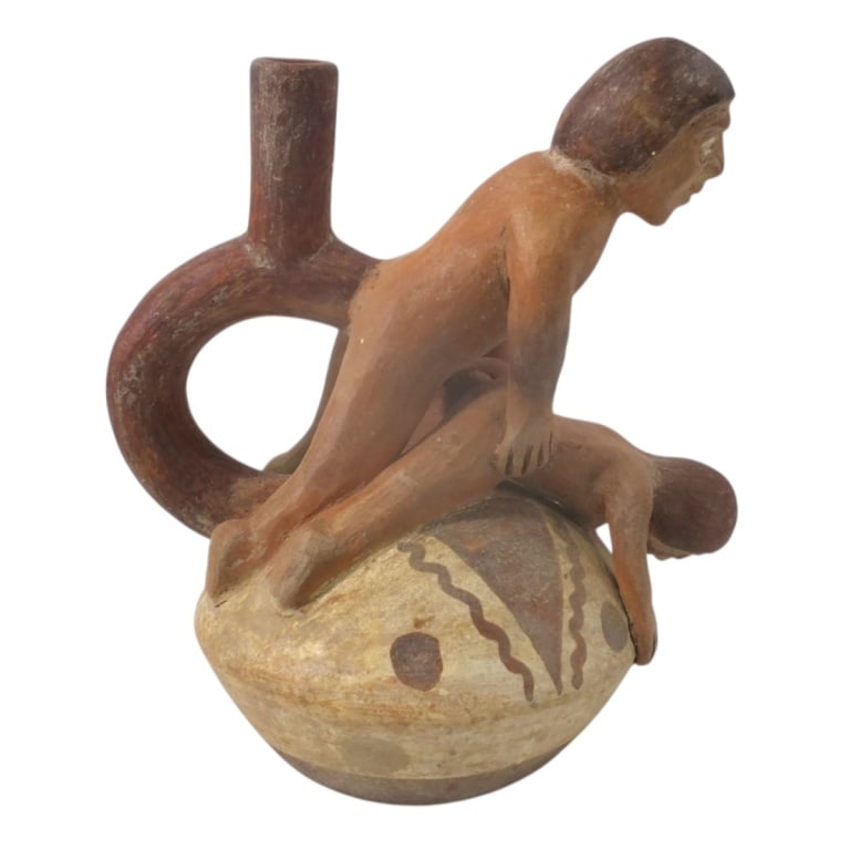 Pre Colombian Moche Erotica Pottery Stirrup Vessel: Pre Colombian Moche Erotica Pottery Stirrup Vessel. Unsigned. Measures 7-1/4" H x 7". Condition: Good condition, no chips, cracks or repairs. Estimate 150 - 300 Domestic shipping Third Party
