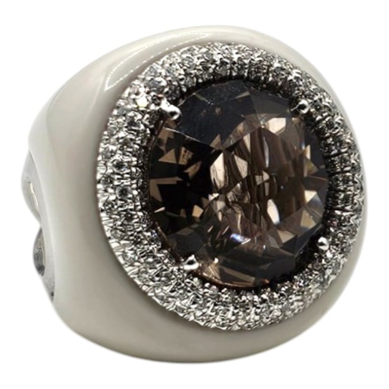18K White Gold Diamond & Agate Ring: 18 Karat White Gold Diamond, Agate Ring with Brown Faceted Center Stone. Stamped. Size: 7. Approx. weight: 18.7 grams. Please note: Due to increased fraudulent activity, customers without an