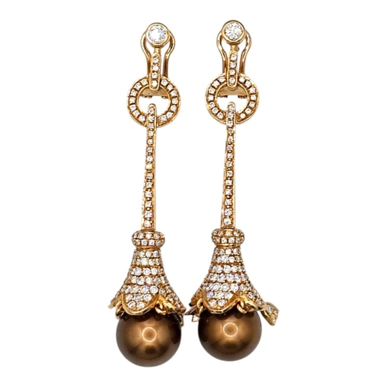Pair of 14K, Diamond & Pearl Earrings: Pair of Fancy 14 Karat Yellow Gold Diamond and Pearl Earrings. Stamped. Measures 2-1/4" L. Approx. weight: 19.8 grams. Please note: Due to increased fraudulent activity, customers without an