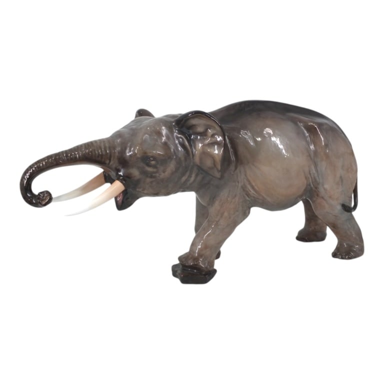 Royal Doulton Porcelain Fighter Elephant HN2640: Royal Doulton Porcelain Figure "Fighter Elephant HN2640". Royal Doulton Backstamp on foot, signature: Michael Doulton, 12 Oct 1976 on foot. Measures 12" H x 24: L x 9" D. Condition: Good condition