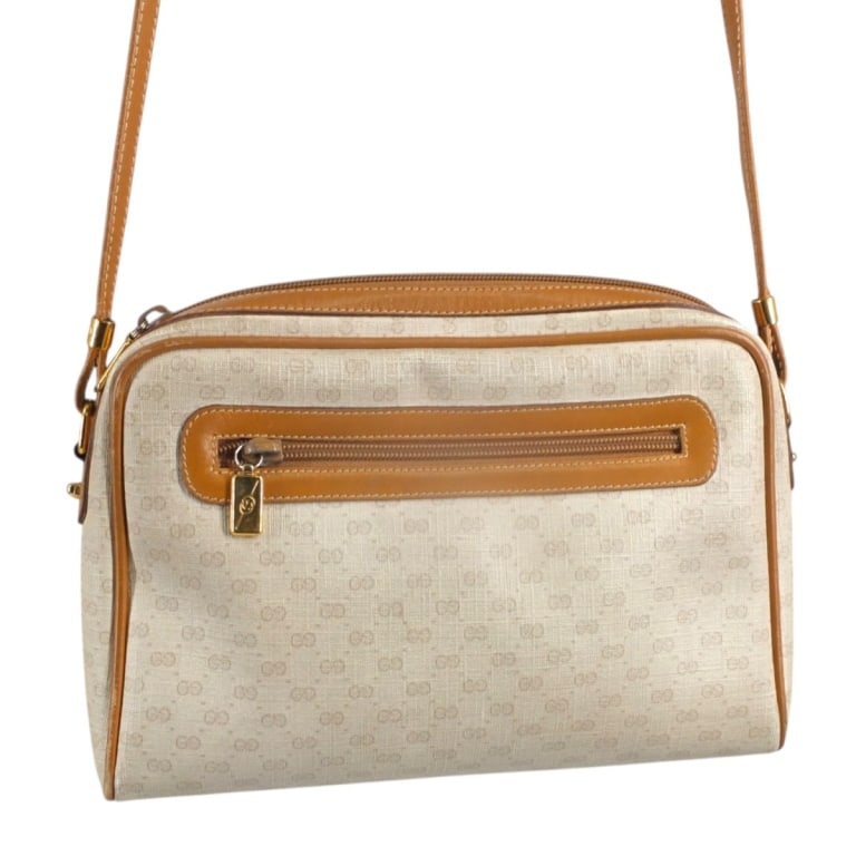 Gucci Micro GG Monogram Beige Canvas Crossbody Bag: Gucci Micro GG Monogram Beige Canvas Crossbody Bag. Outside and inside pockets, zipper closure. Tan leather and gold tone hardware, brown canvas interior, adjustable strap. Labeled appropriately, seri