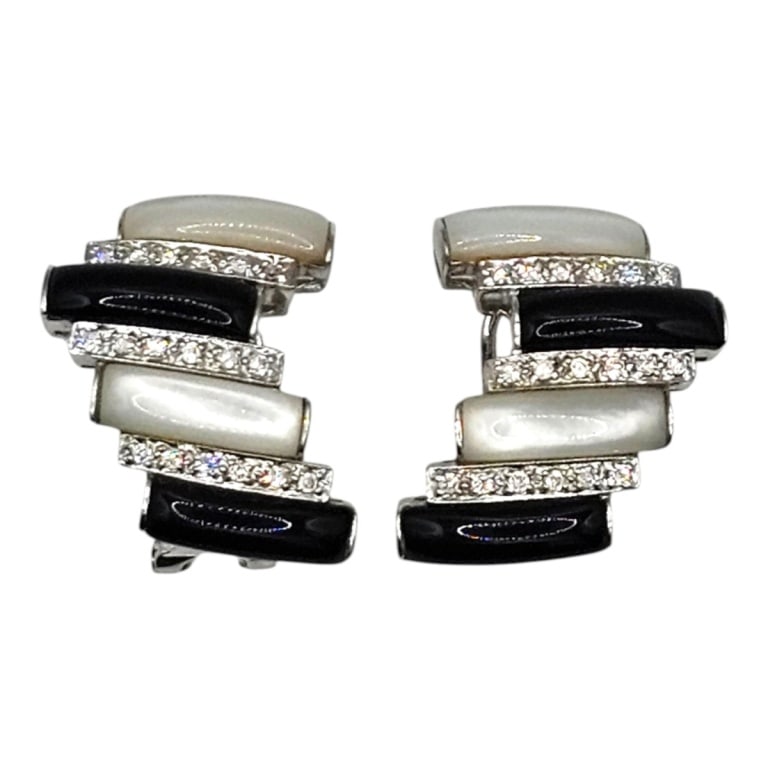 Pair of 18K Diamond Moonstone & Onyx Earrings: Pair of 18 Karat White Gold Diamond, Moonstone and Onyx Clip-On Earrings. Measures 1-1/4". Approx. weight: 12.5 grams. Please note: Due to increased fraudulent activity, customers without an establish