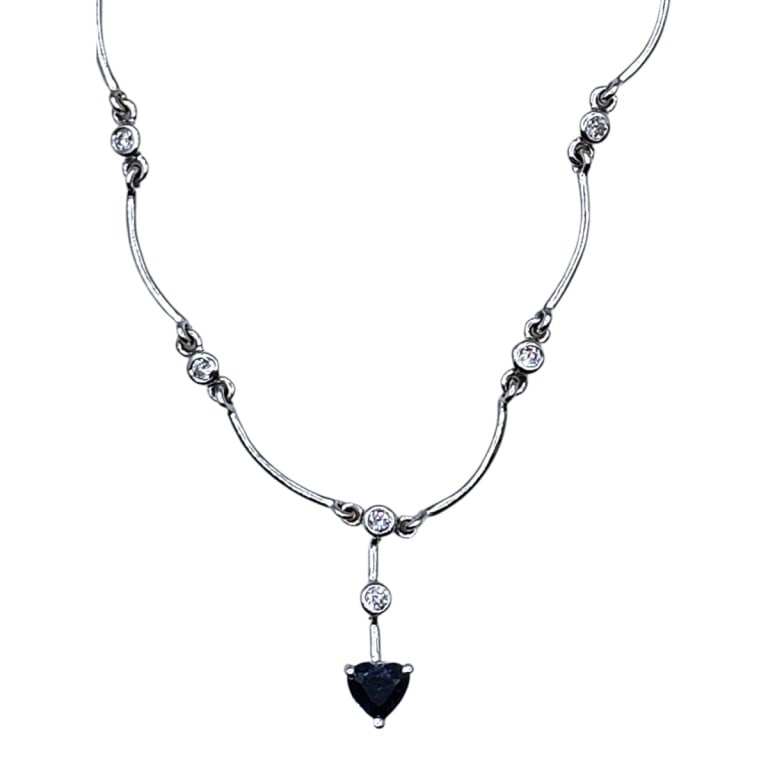 Vintage 14K & Diamond Necklace: Vintage 14 Karat White Gold and Diamond Necklace with Sapphire Pendant. .35 TCW diamond. .35 TCW sapphire Measures 16" L. Approx. weight: 9.1 grams. Please note: Due to increased fraudulent activity, 