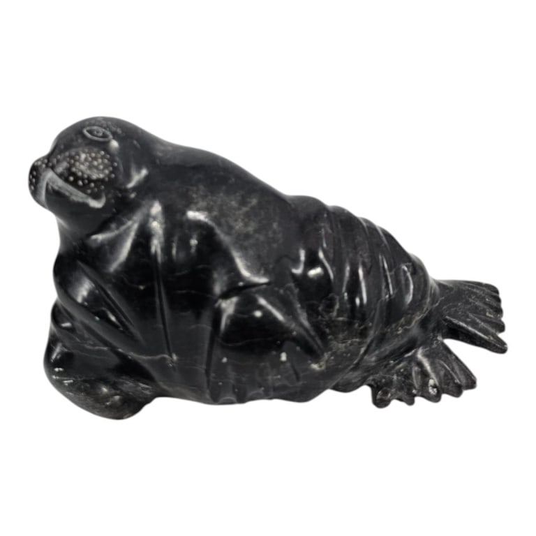 Vintage Canadian Intuit Stone Sculpture, Seal: Vintage Canadian Eskimo Intuit Stone Sculpture "Seal". Signed, dated '81, original label on bottom. Measures 4-1/2" x 8" x 5". Condition: Good condition. Estimate 100 - 200 Domestic shipping Third Par