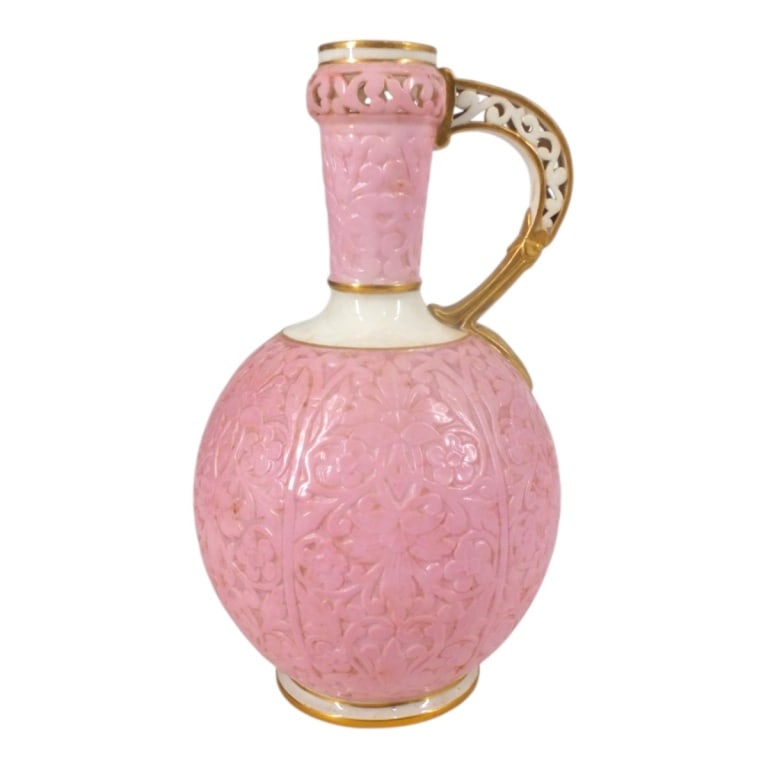 Grainger & Co Worcester Reticulated Bottle: Grainger & Co Worcester Reticulated Porcelain Bottle. Decorated in pink, ivory and gold. Signed G & Co in shield on underside. Measures 7" H. Condition: No top or in good condition. Estimate 120 - 240