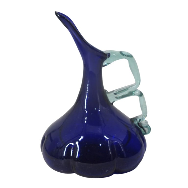 Vintage Murano Glass Pitcher: Vintage Murano Cobalt Blue Art Glass Pitcher. Measures 11" x 8". Condition: Has an internal crack to the body. Estimate 60 - 120 Domestic shipping Third party