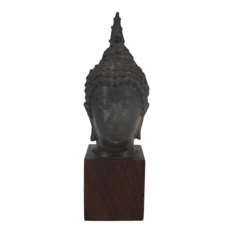 Miniature Sukhothai Bronze Buddha Head: Miniature Sukhothai Bronze Buddha Head on Wood Base. Unsigned. Measures 7". Condition: Good condition. Estimate 120 - 240 Domestic shipping Third Party