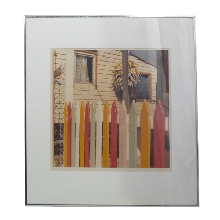 Vintage Photographic Print "Picket Fence": Sally Troyer (American, 20/21st) Photographic Print "Picket Fence". Signed, dated 1981 lower right. Framed and under glass. Measures 15" x 15", frame 24" x 23". Condition: Faded or in good condition. 