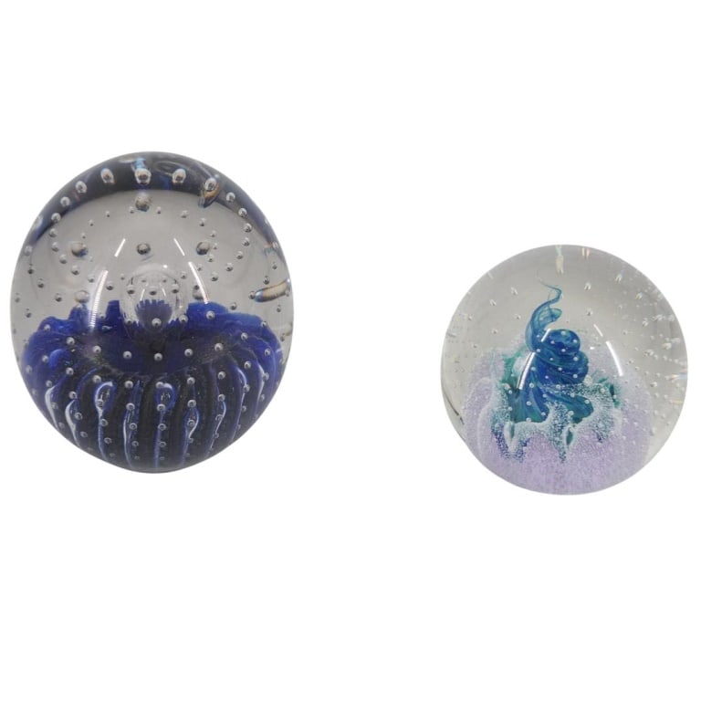 Grouping of Art Glass Paperweights: Grouping of Two Art Glass Paperweights. Makers: Robert Eckholt and Caithness "Fascination". Largest measures 4-1/4" x 3-1/4". Remaining measures 3" x 3". Condition: Both are in good condition.
