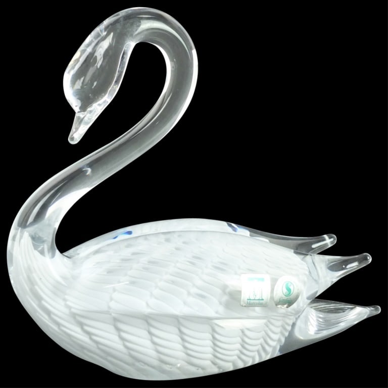 Marcolin Sardinia Glass Figurine: Marcolin Sardinia Art Glass Swan Figurine. Signed on the base and sticker labels attached to the surface. Measures 6-3/4" x 3-1/4" x 7-1/4". Condition: Good condition. Estimate 50 - 150 Domestic