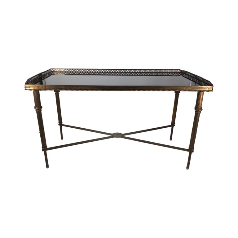 Manner of Maison Jensen Side Table: Manner of Maison Jensen brass side table with black glass top. Base measures 21-3/4" x 26-5/8". Condition: Rubbing to the brass, minor scuffs to the top. Missing support ornament. Slight bending to