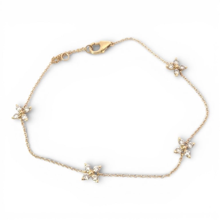 14K Yellow Gold & Diamond Leaf Bracelet: Vintage 14 karat yellow gold and .50 carat round diamond bracelet with leaf motif. Stamped. Color: G-H Clarity: SI. Measures 7". Approx. weight: 1.8 grams. Condition: Good condition. Estimate 800 -