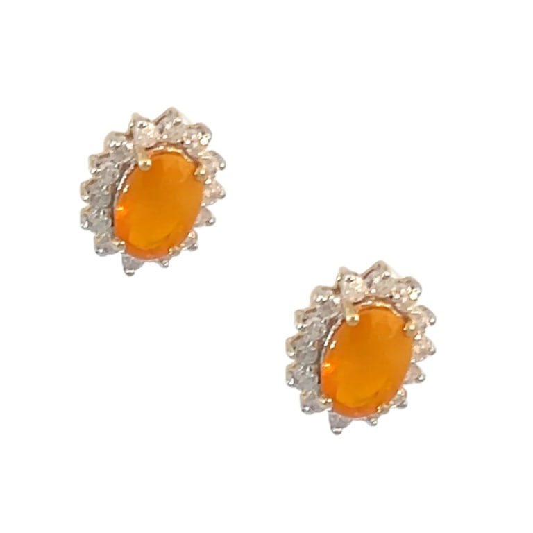 Pair of 14k Yellow Gold & Diamond Earrings: Pair of vintage 14k Yellow Gold, diamond and opal earrings. Diamonds are round brilliant cut .30 carat, color F-G, SI1 clarity. 1.50 carat oval Mexican opal. Measures 3/8". Approx. weight: 2.2 grams.