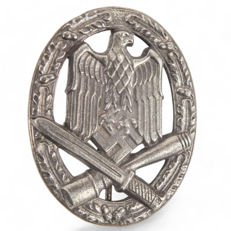 German WWII Badge: German WWII General Assault Badge. Marked on the reverse side. Measures 2-1/8" x 1-5/8". Please note; this item has not been authenticated by a third-party expert. The seller makes no guarantees