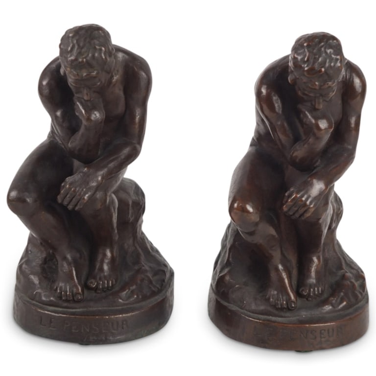 After: Auguste Rodin (1840 - 1917) Bookends: Pair of Neoclassical Style Composition Bookends After: Auguste Rodin (1840 - 1917) and Titled "Le Penseur". Marked on obverse side. Overall measures 9" x 4-3/4" x 4-3/4". Condition: Good condition.