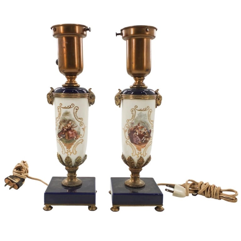 Pair of Sevres Style Lamps: Pair of Sevres Style Cobalt and Gilt Porcelain Lamps with Ormolu Mounts. Overall measures 13" x 3-1/4". Condition: No shade. Some hairlines to the upper girdle. Estimate 100 - 300 Domestic shipping