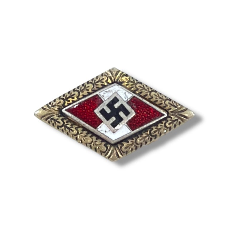 German WWII Hitler Youth Golden Badge of Honor: German WWII Hitler Youth Golden Badge of Honor. Marked BM 1/22 RZM to backside. Measures 7/8" x 1-1/2". Please be advised: This item has not been authenticated by an independent expert, and the