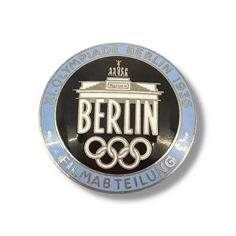 German WWII 1936 Berlin Summer Olympics Badge: German WWII 1936 Berlin Summer Olympics Filmmaker Badge. Marked Rob. Neff Berlin W 57 on the reverse side. Measures 1-7/8" diam. Please be advised: This item has not been authenticated by an