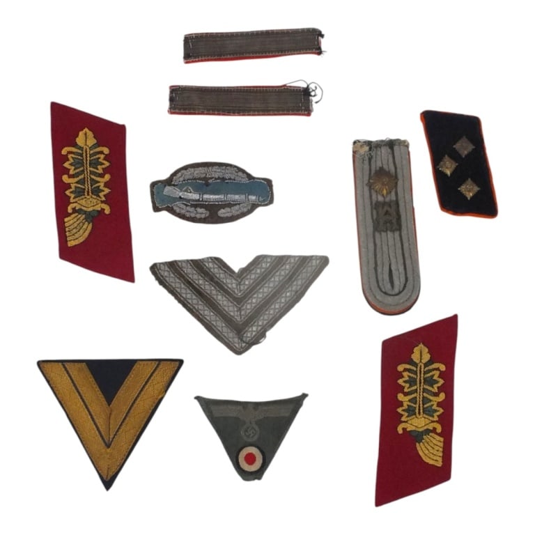 10 Piece WWII Militaria Insignia Lot: 10 Piece WWII Militaria Insignia Lot. Includes, patches, stripes, shoulder board, collar tabs. Largest measures 4-1/2" x 2". Please be advised: This item has not been authenticated by an independent