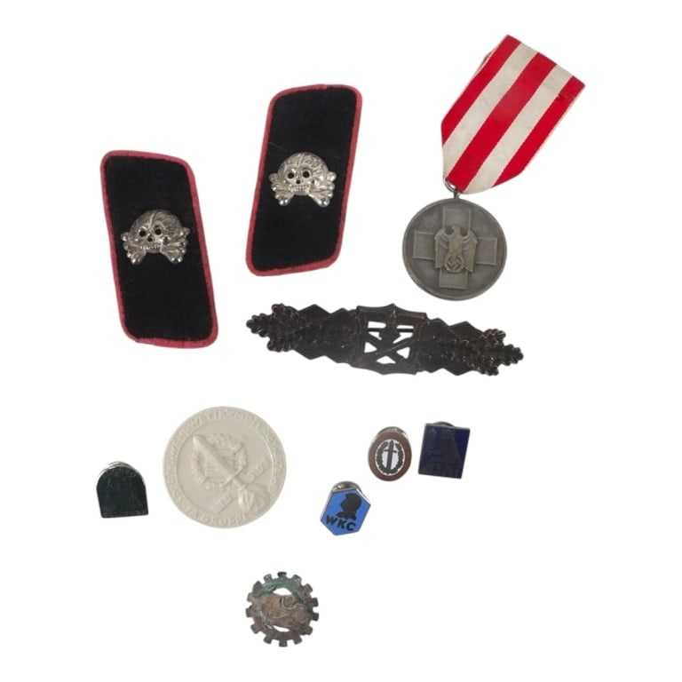 10 Piece WWII Militaria Insignia Lot: 10 Piece WWII Militaria Insignia Lot. Includes: badges,collar tabs, medals. Largest measures 3-3/4" x 1". Please be advised: This item has not been authenticated by an independent expert, and the