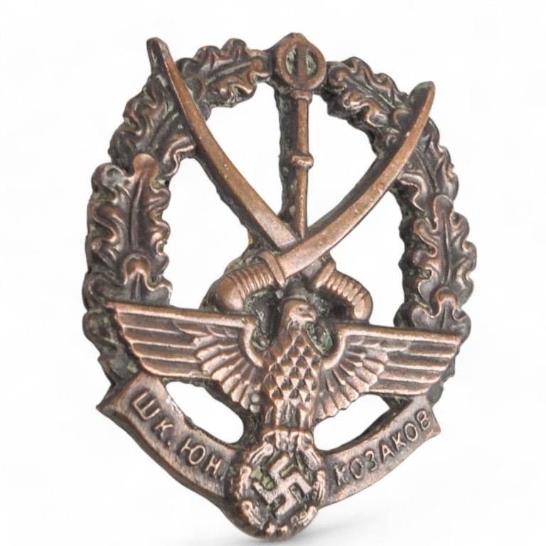German WWII Badge: German WWII Young Cossack Badge. Measures 1-7/8" x 1-5/8". Please note; this item has not been authenticated by a third-party expert. The seller makes no guarantees regarding its authenticity.