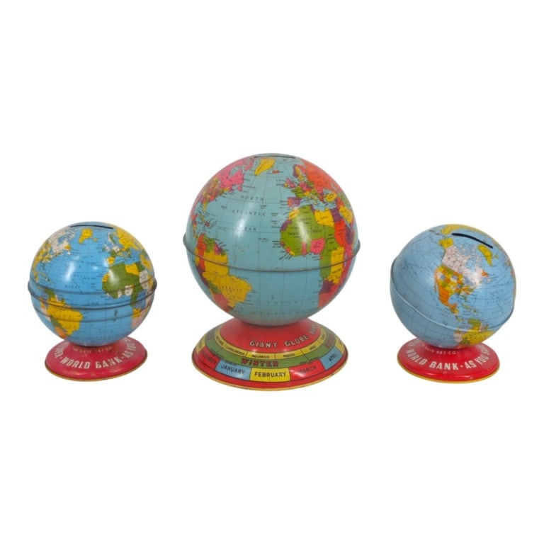 Grouping of Circa 1940s Tin Coin Banks: Grouping of Three Circa 1940s Tin Coin Banks. Markers: J. Chien Co., The Ohio Art Co. Tallest measures 7" x 5-3/4". Smallest measures 5" x 4". Condition: Tallest bank has dings to the surface. All