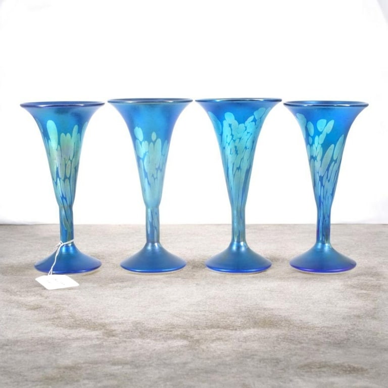 4 Carl Radke Phoenix Studios Art Glass Flutes: 4 Carl Radke Phoenix Studios Art Glass Flutes. Iridescent blue glass with oil spot motif. Signed. Measures 9-1/4" H. Condition: Good condition with no chips or cracks. Estimate 200 - 400 Domestic