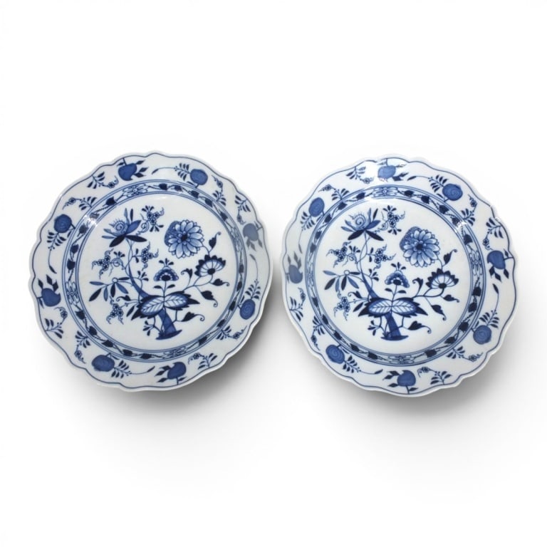 2 Meissen Blue Onion Chop Plates 12": 2 Meissen Blue Onion Chop Plates (Round Platter). Signed with crossed swords mark. Measures 12". Condition: Good condition with no chips or cracks. Estimate 300 - 400 Domestic shipping Third Party