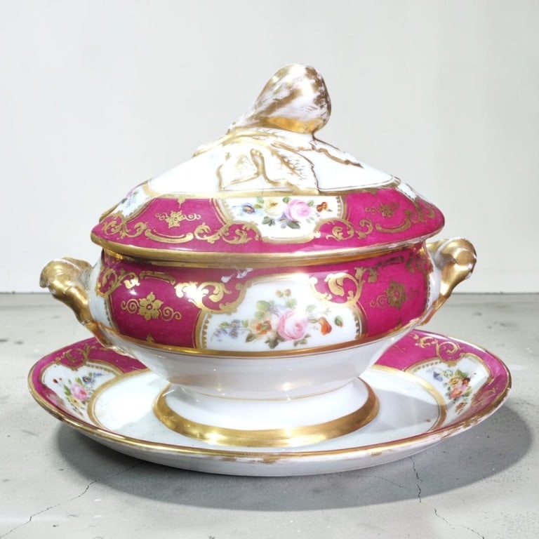 Antique Hand Painted Covered Sauce Tureen: Antique Hand Painted Porcelain Covered Sauce Tureen. Attached underplate. Unsigned. Measures 7" H x 9-1/2" L. Condition: Wear to gilt consistent with age and use. No chips or cracks. Estimate 60 -