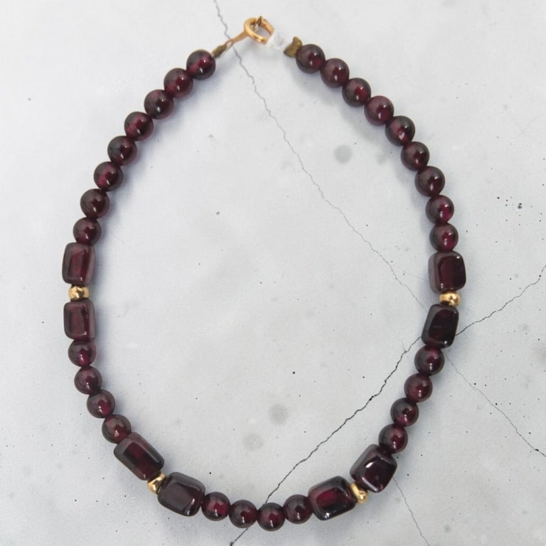 Garnet & 14K Gold Beaded Bracelet: Garnet & 14K Gold Beaded Bracelet. Stamped 14K. Measures 7". Condition: Good condition. Estimate 100 - 200 Domestic shipping Third Party