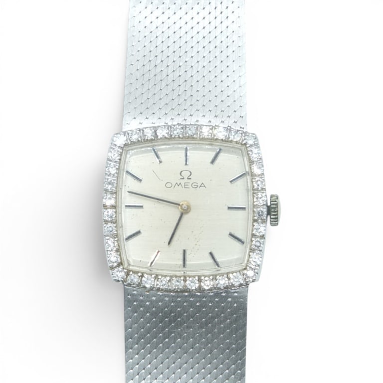 Vintage Omega 14K, Diamond Watch: Vintage Omega 14 Karat White Gold and Brilliant Cut Diamond Watch. Stamped. Case: 24mm. Measures 7". Approx. weight: 53.6 grams. No box or papers. Please note the gallery does not warranty the