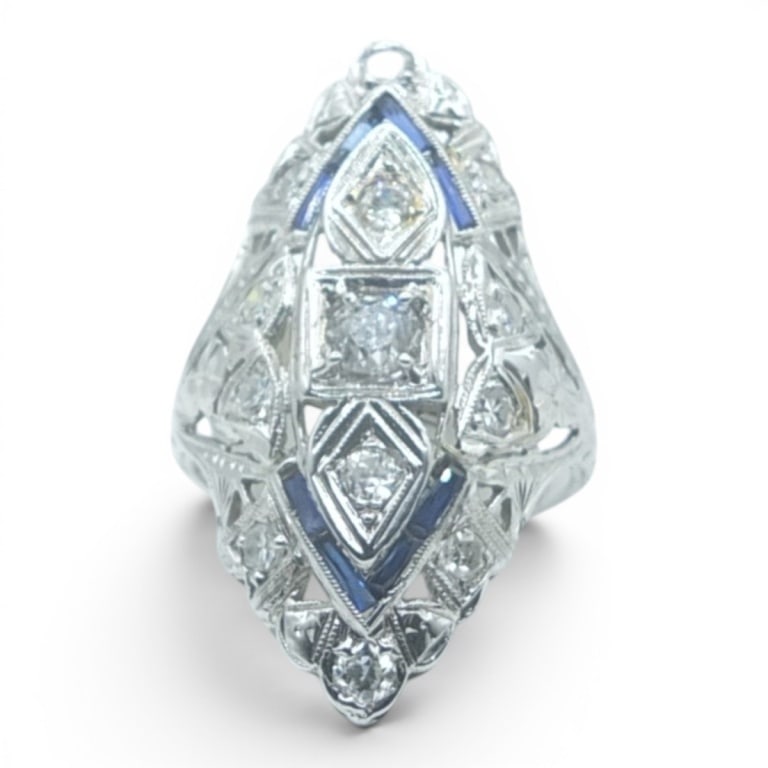 18K Art Deco Style Diamond & Sapphire Ring: Fancy 18 Karat White Gold Art Deco Style Diamond and Sapphire Ring. Stamped. 1.35 CTW si1 Synthetic sapphires Size: 6.5. Approx. weight: 4.9 grams. Condition: Good condition. Estimate 2000 - 3000
