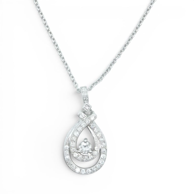 Vintage 14K Diamond Pendant w/ Necklace: Vintage 14 Karat White Gold Diamond Pendant with Necklace. Diamond: .55 TCW, G-color, s12. Measures 18" L. Approx. weight: 5.6 grams. Condition: Good condition. Estimate 1000 - 1500 Domestic shipping